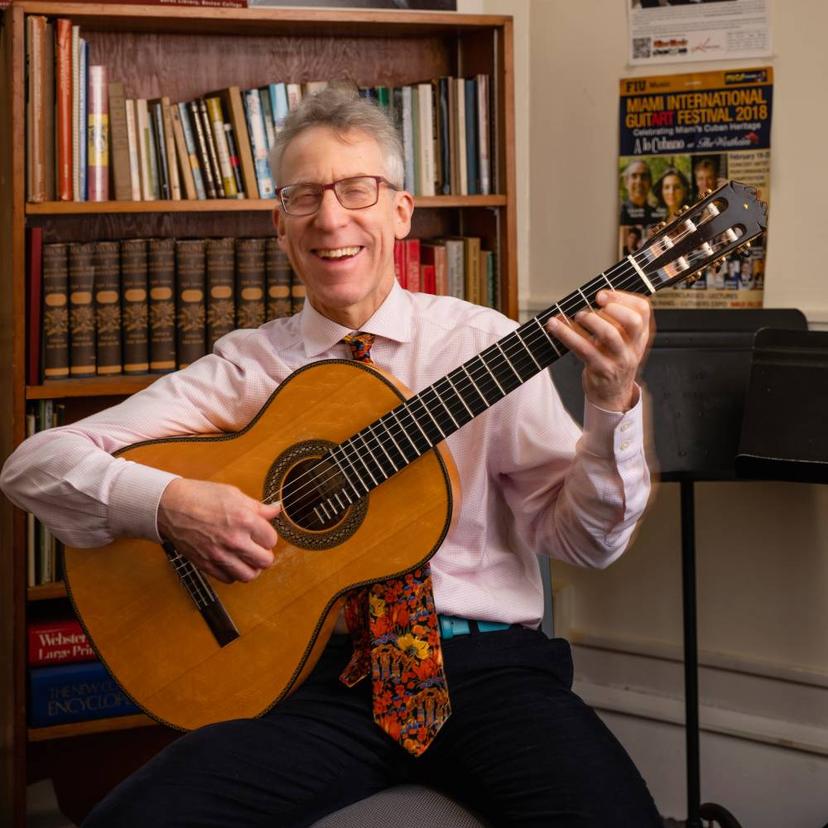 Eliot Fisk playing the guitar